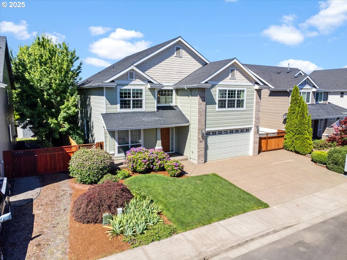 863 June Drive Molalla, OR 97038 - Photo 2 of 36 a front view of a house with a yard and garage