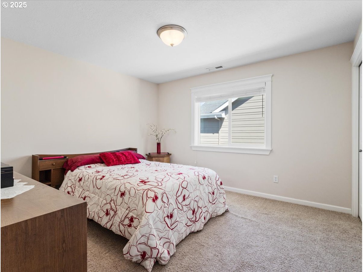 863 June Drive Molalla, OR 97038 - Photo 21 of 36 a bedroom with a bed and a window