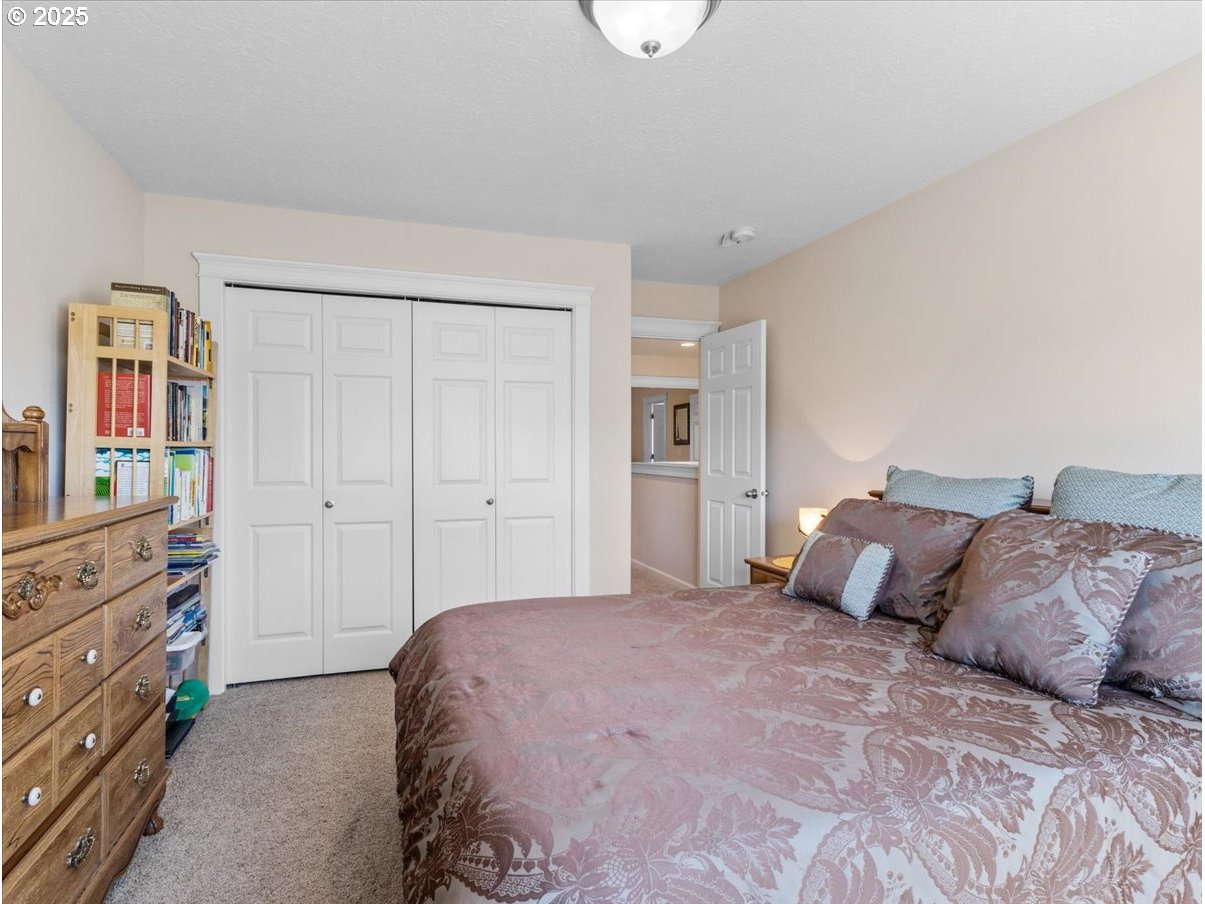 863 June Drive Molalla, OR 97038 - Photo 24 of 36 a bedroom with a bed and a cabinets