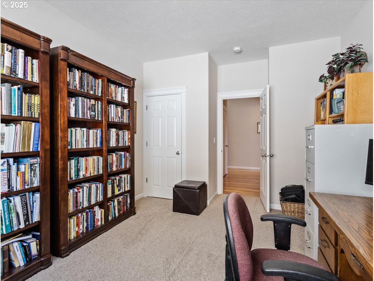 863 June Drive Molalla, OR 97038 - Photo 28 of 36 a room with a book shelf and a couch