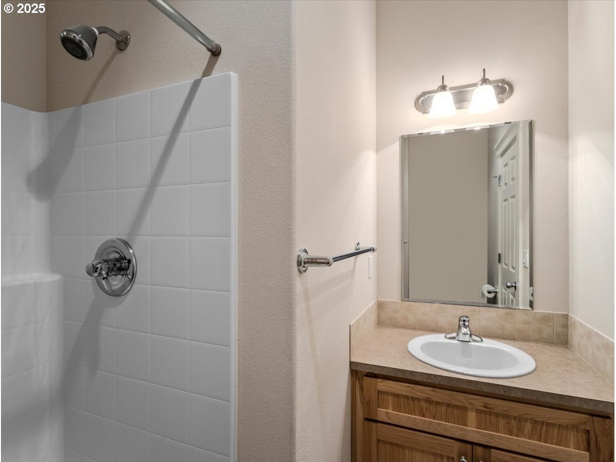 863 June Drive Molalla, OR 97038 - Photo 29 of 36 a bathroom with a sink and a mirror