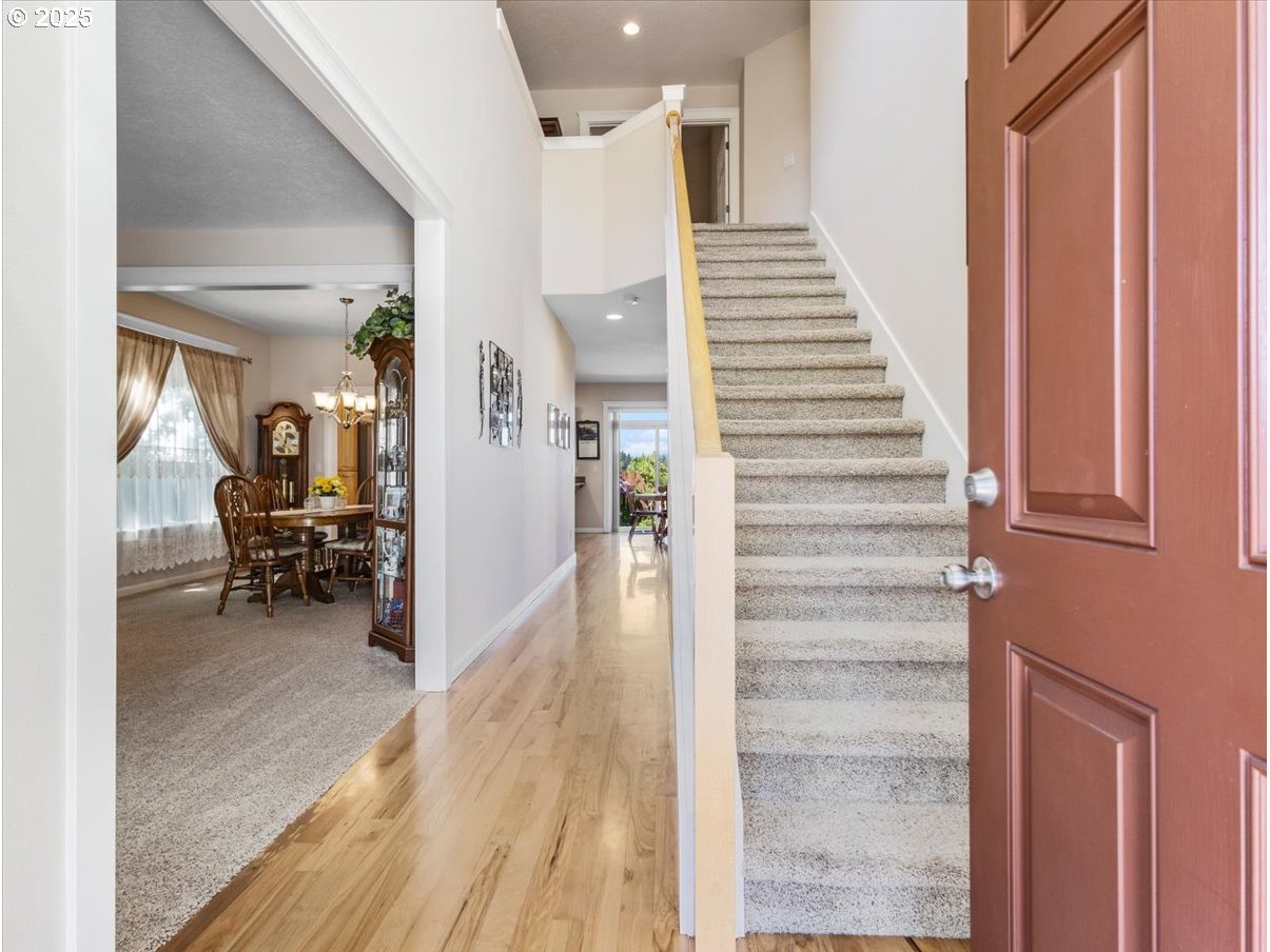 863 June Drive Molalla, OR 97038 - Photo 3 of 36 a view of a hallway view with staircase and white walls