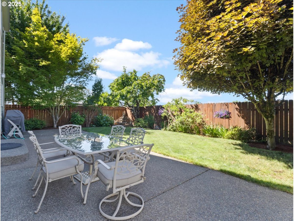 863 June Drive Molalla, OR 97038 - Photo 32 of 36 a view of a chairs and table in the backyard