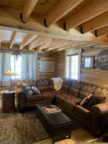 a kitchen with sink and refrigerator