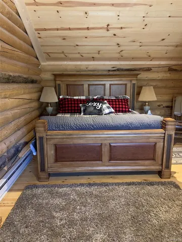 a bathroom with a toilet and a mirror