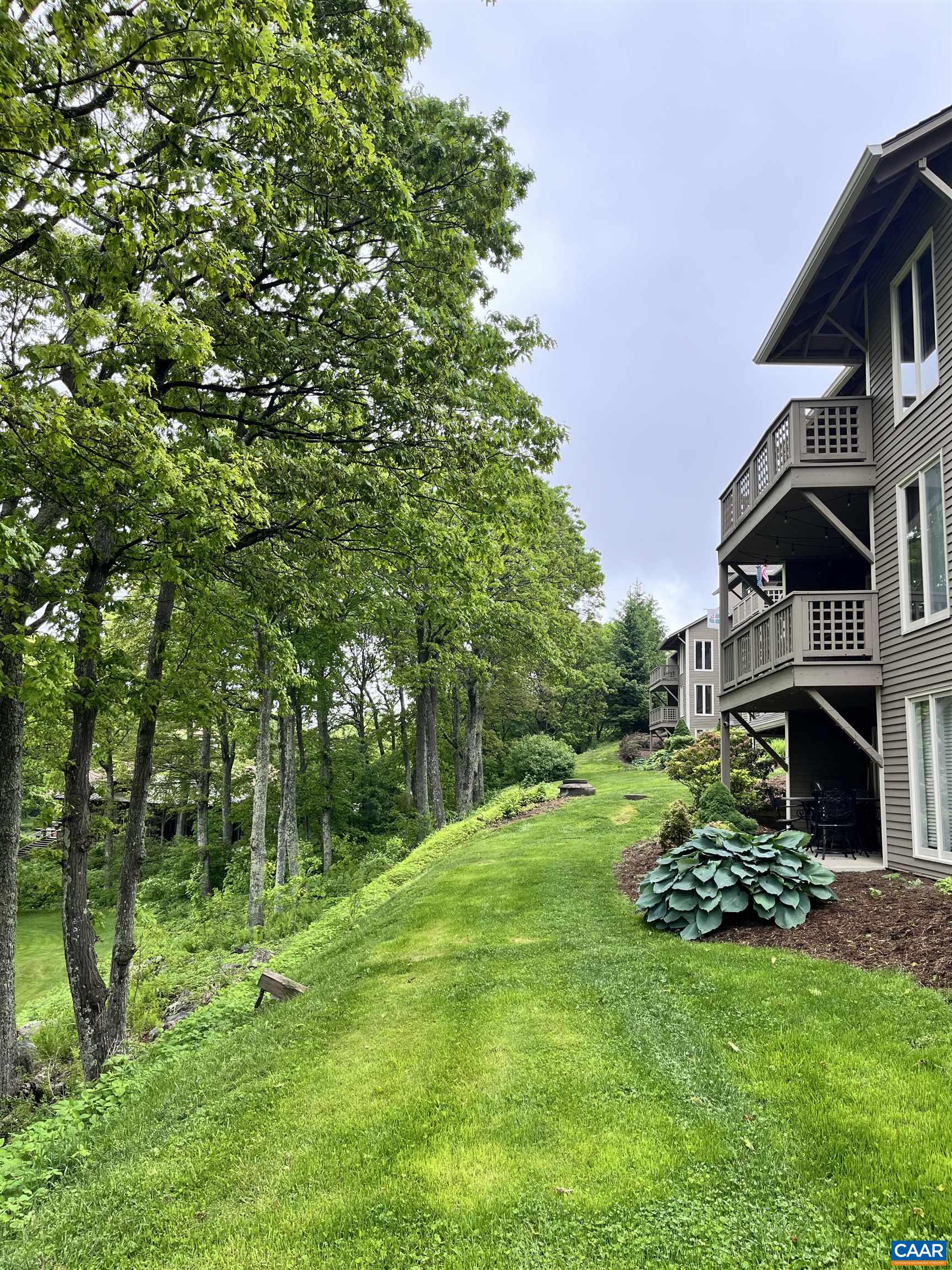 2052 Stone Ridge Wintergreen, VA 22967 - Photo 10 of 17 a front view of a house with a garden