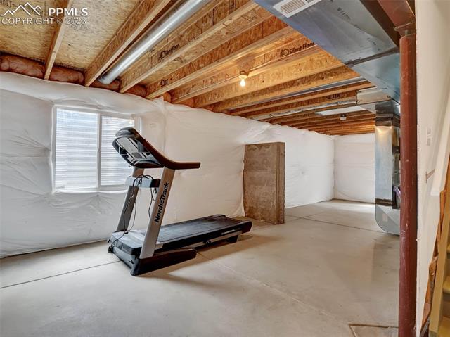 5347 Gentle Wind Road Colorado Springs, CO 80922 - Photo 22 of 28 Unfinished lower level is your blank canvas