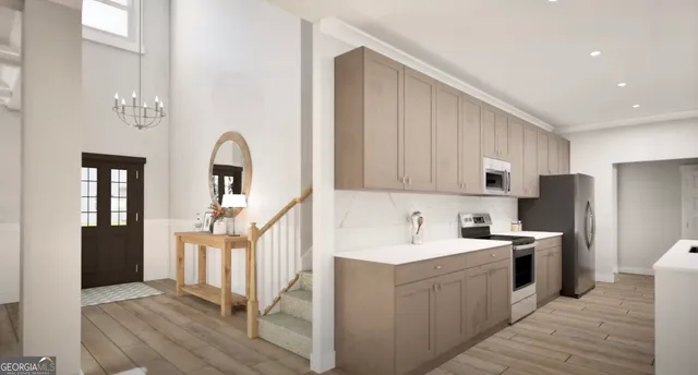 a kitchen with a sink a refrigerator and cabinets