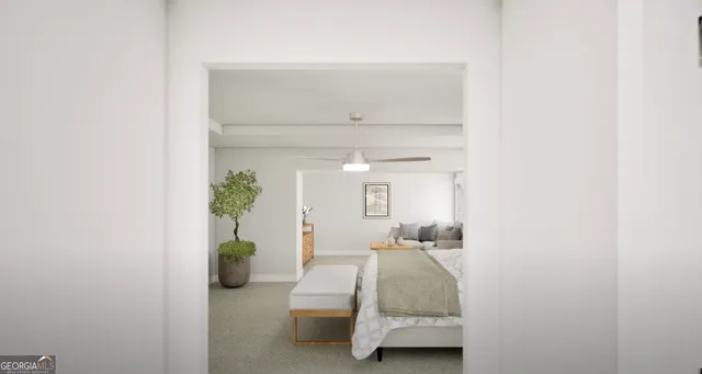 a room with a bed and a potted plant