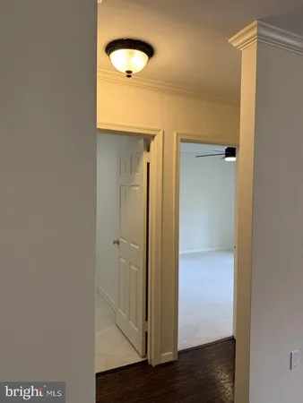 a view of hallway with bathroom