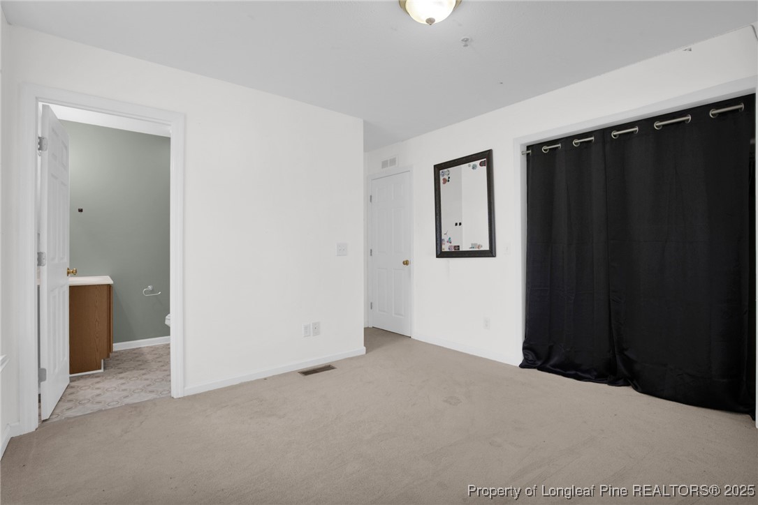 112 Madison Road Carthage, NC 28327 - Photo 16 of 27 an empty room with windows