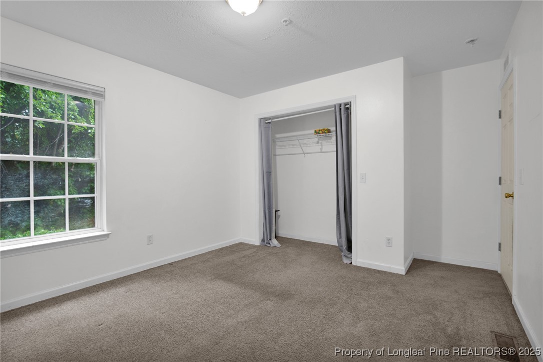 112 Madison Road Carthage, NC 28327 - Photo 20 of 27 a view of empty room with windows