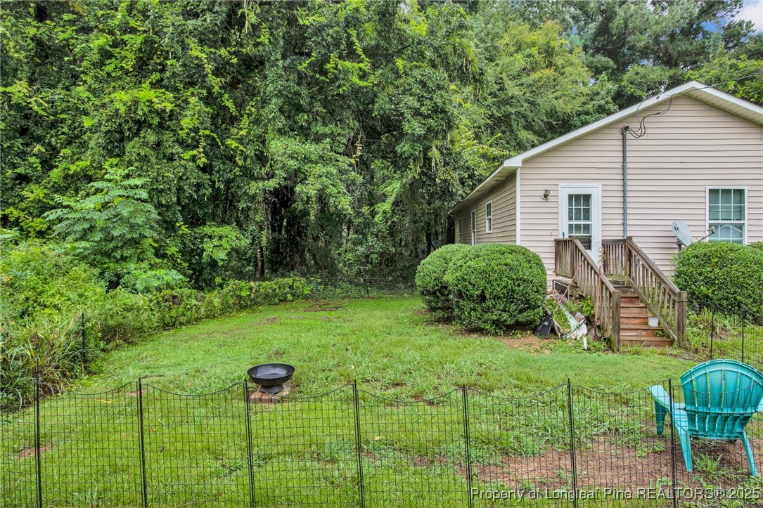 112 Madison Road Carthage, NC 28327 - Photo 24 of 27 a view of a house with backyard and garden