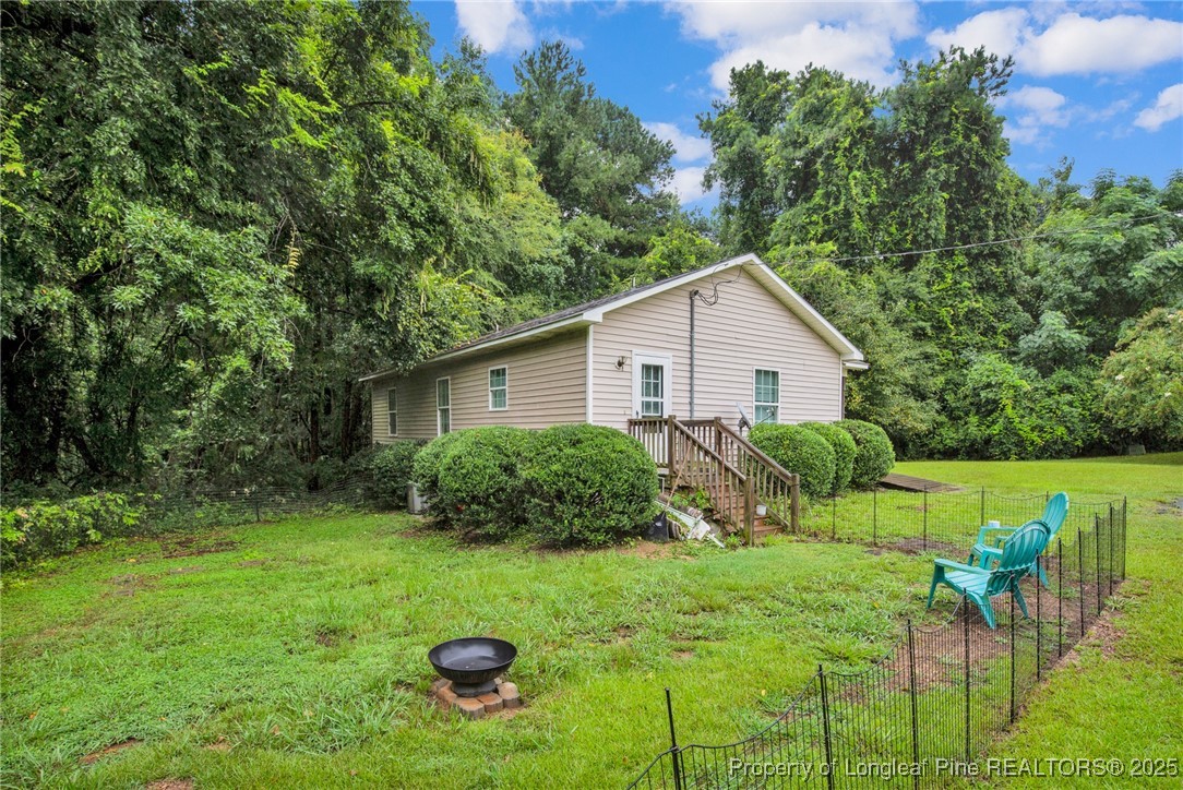 112 Madison Road Carthage, NC 28327 - Photo 25 of 27 a view of backyard of house with green space