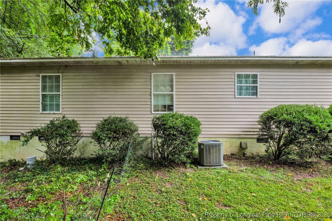 112 Madison Road Carthage, NC 28327 - Photo 26 of 27 a side view of a house with a yard