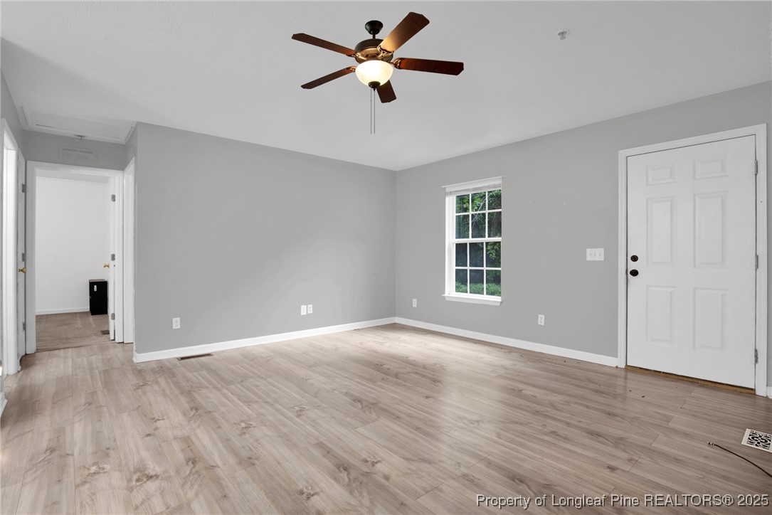 112 Madison Road Carthage, NC 28327 - Photo 6 of 27 wooden floor in an empty room with a window