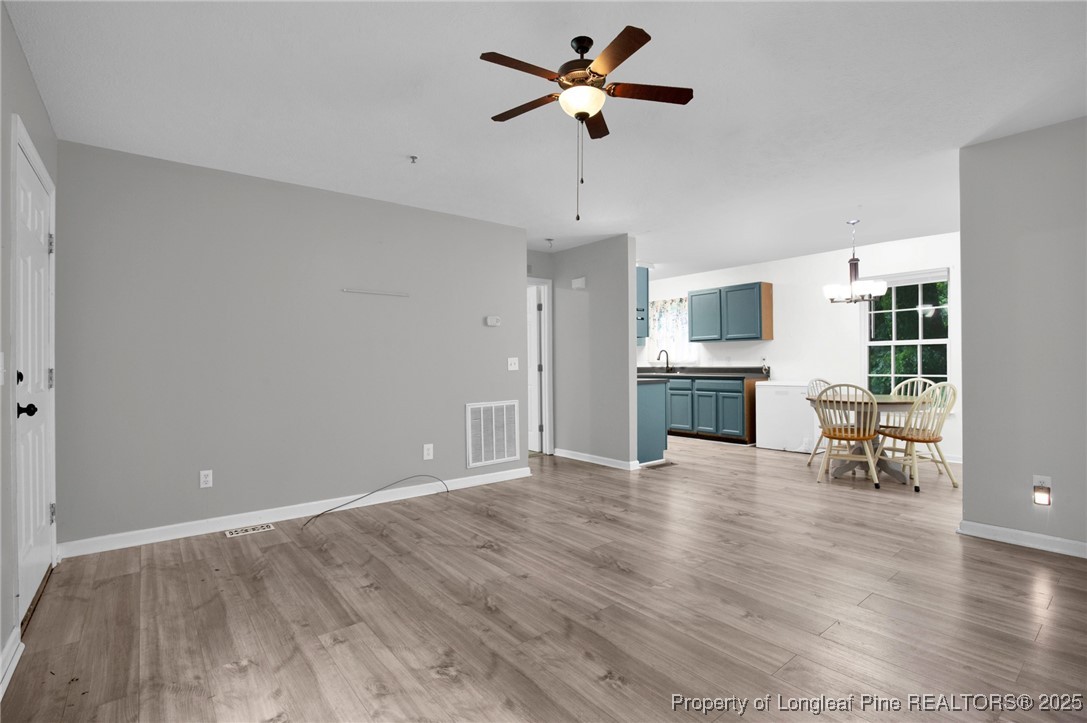 112 Madison Road Carthage, NC 28327 - Photo 7 of 27 a view of livingroom with hardwood floor and a ceiling fan