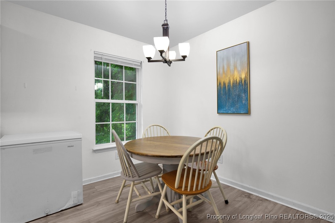 112 Madison Road Carthage, NC 28327 - Photo 9 of 27 a view of a dining room with furniture and chandelier