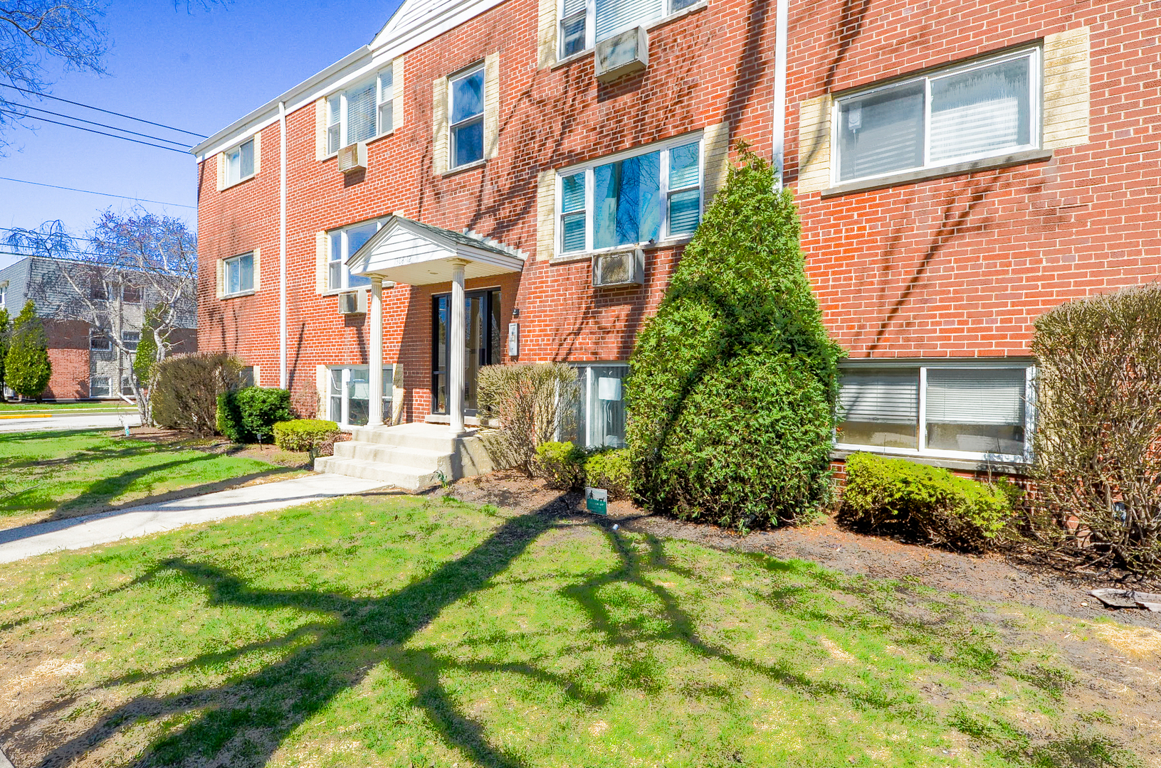 1308 Perry Street, Unit B Des Plaines, IL 60016 - Photo 2 of 11 a view of a building with a yard
