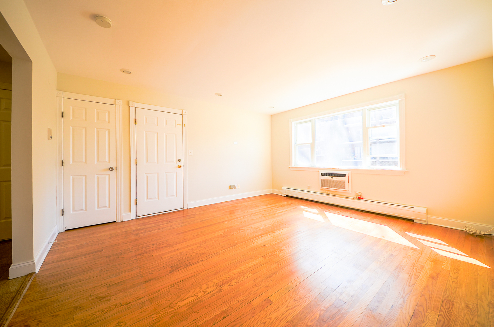 1308 Perry Street, Unit B Des Plaines, IL 60016 - Photo 3 of 11 a view of an empty room and a window