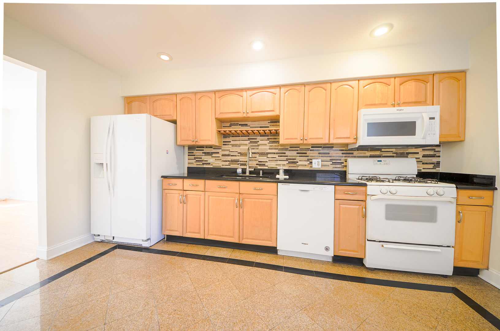 1308 Perry Street, Unit B Des Plaines, IL 60016 - Photo 6 of 11 a kitchen with stainless steel appliances a stove sink and white cabinets
