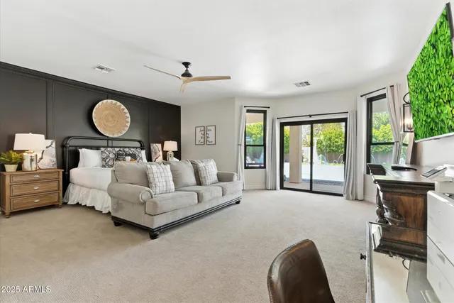 a bed room with furniture and a chair