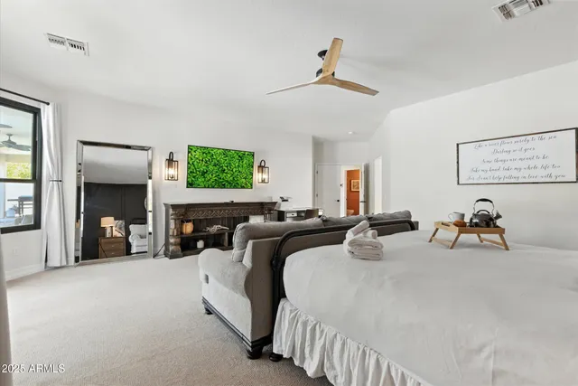 a bed room with two beds and a large window