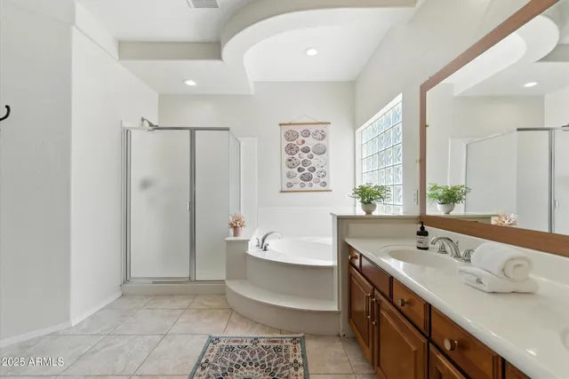 a bathroom with a tub sink and a mirror
