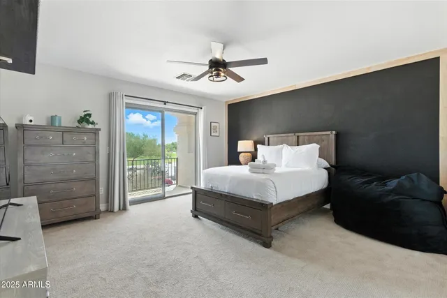 a bedroom with a bed and a desk