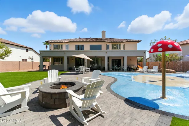 swimming pool view with a seating space