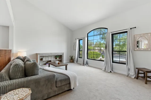 a bed room with a bed and a chair