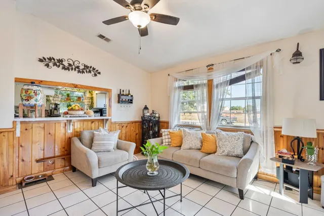 a living room with furniture and a large window