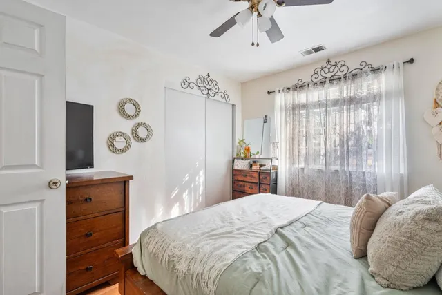 a bedroom with a bed and a dresser