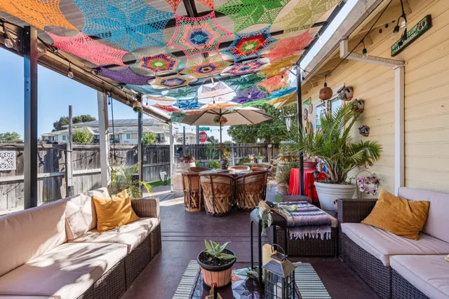 a outdoor living space with patio furniture and potted plants
