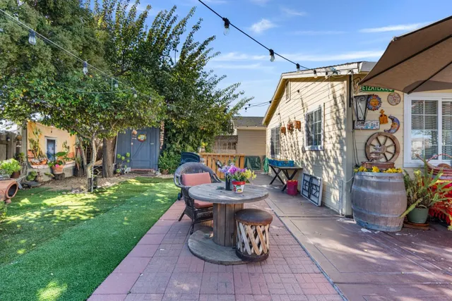 a view of a backyard with sitting area