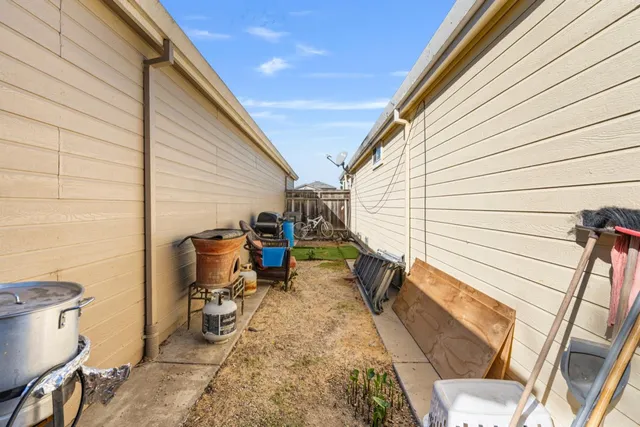 a view of a backyard with sitting area