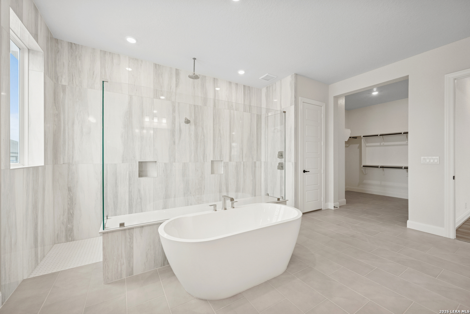 761 Falcon Cove Castroville, TX 78009 - Photo 7 of 11 a bathroom with a bathtub and shower