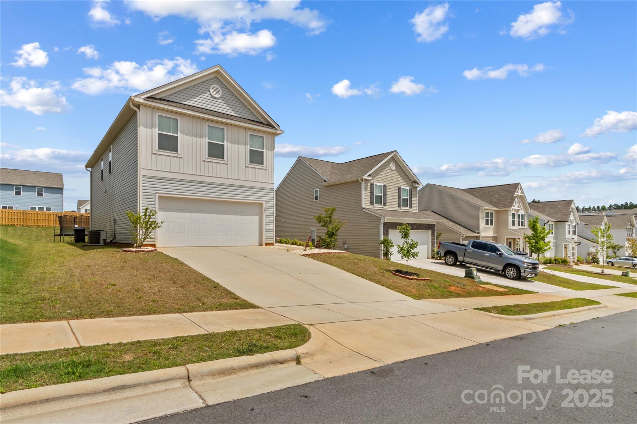125 Mooring Drive Statesville, NC 28677 - Photo 1 of 32 a front view of a house with a garden
