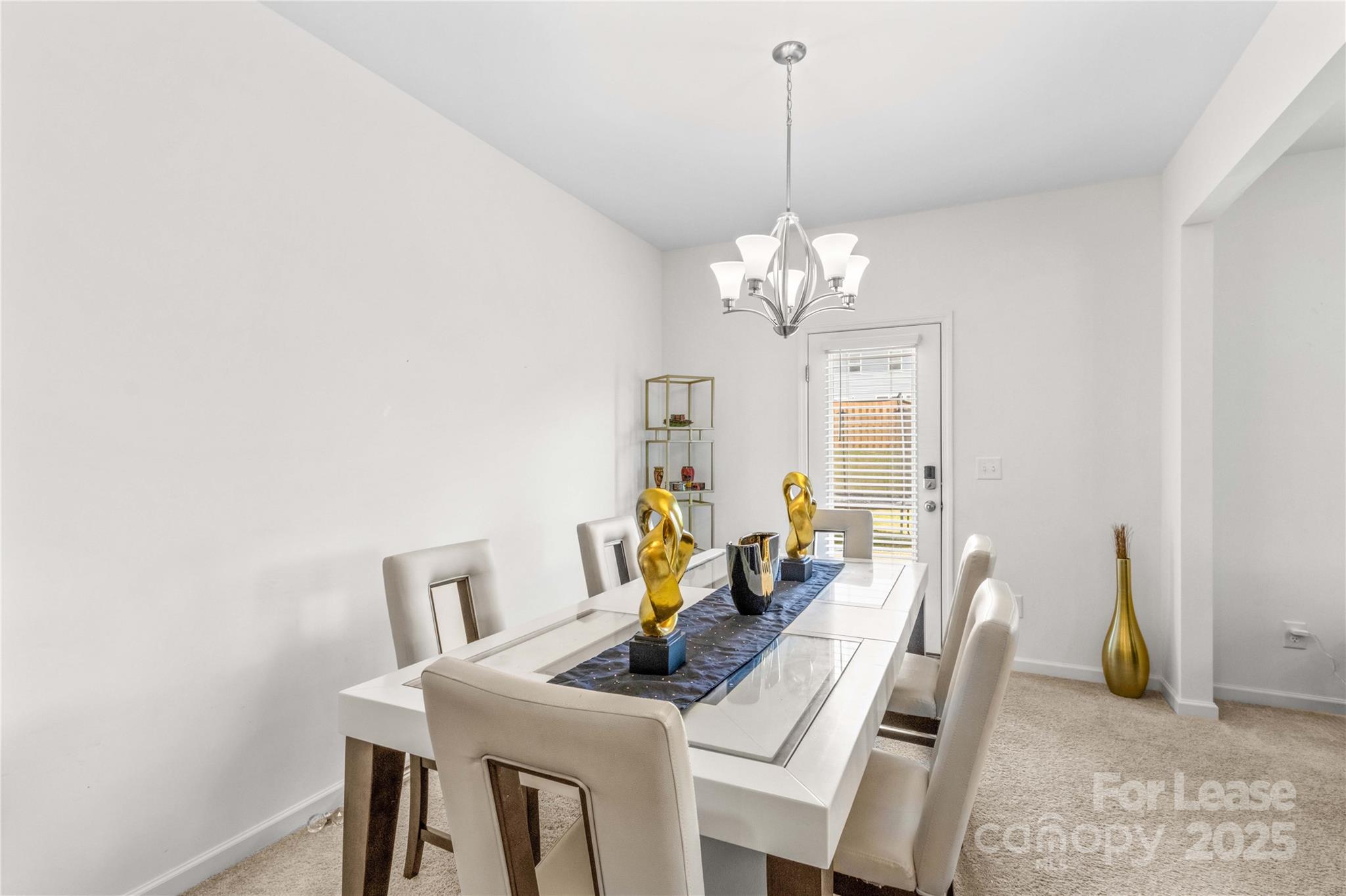 125 Mooring Drive Statesville, NC 28677 - Photo 12 of 32 a view of a dining room with furniture and chandelier