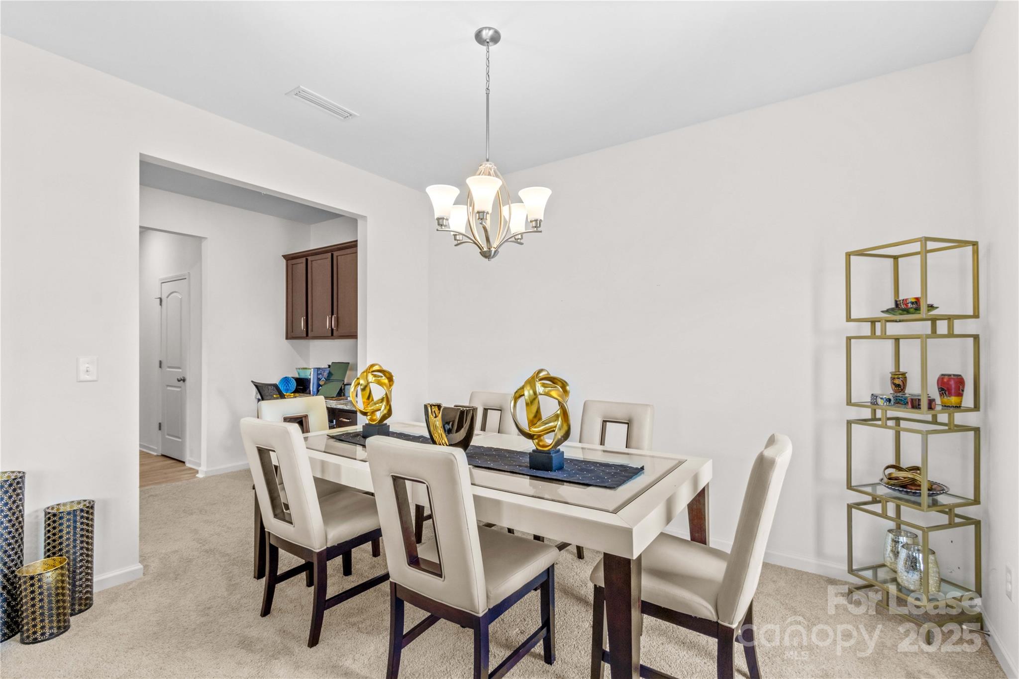 125 Mooring Drive Statesville, NC 28677 - Photo 13 of 32 a view of a dining room with furniture and chandelier