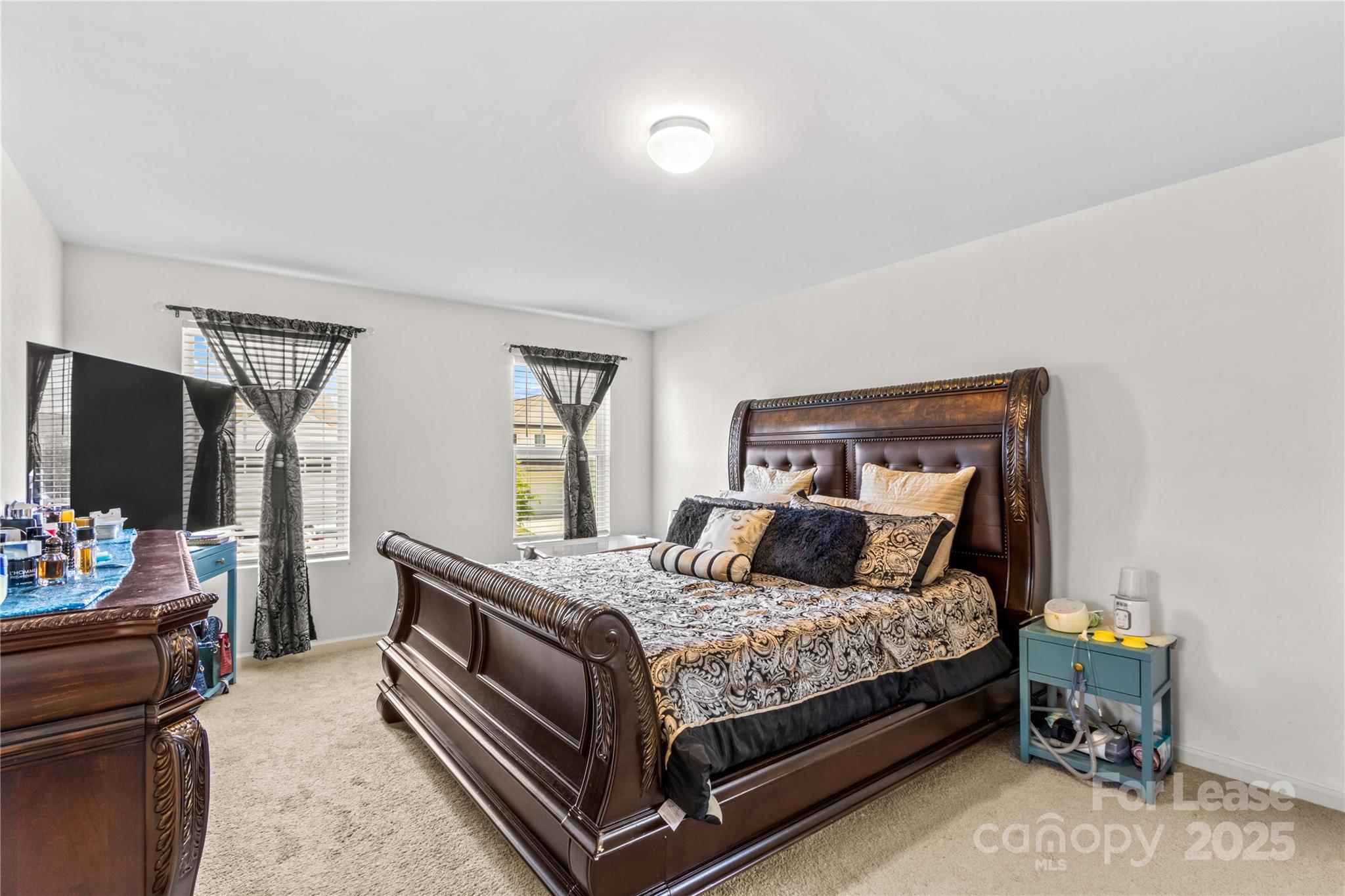 125 Mooring Drive Statesville, NC 28677 - Photo 18 of 32 a bedroom with a bed and a flat screen tv