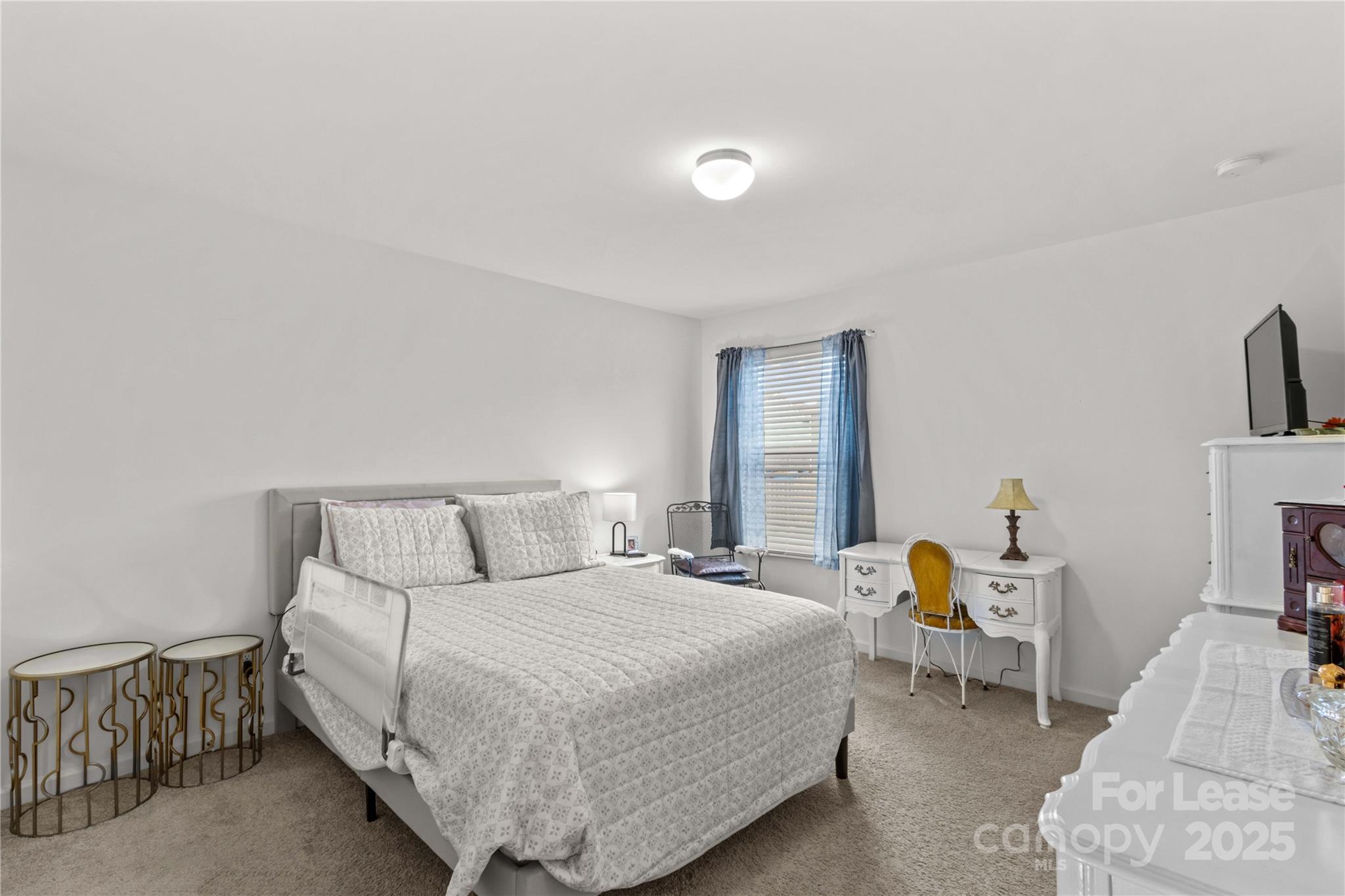 125 Mooring Drive Statesville, NC 28677 - Photo 24 of 32 a bedroom with a bed and a couch