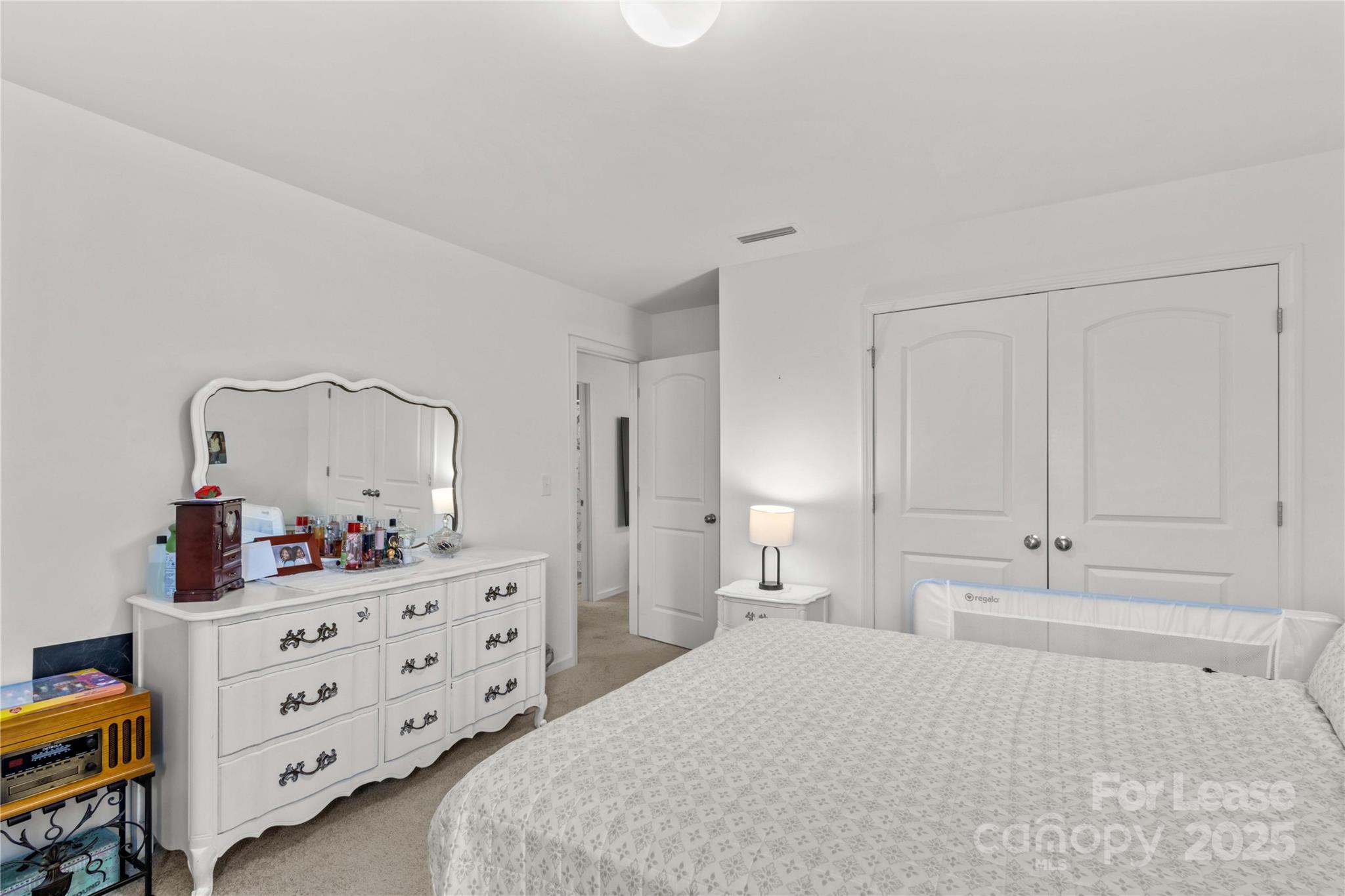 125 Mooring Drive Statesville, NC 28677 - Photo 25 of 32 a bedroom with a bed and a dresser in it