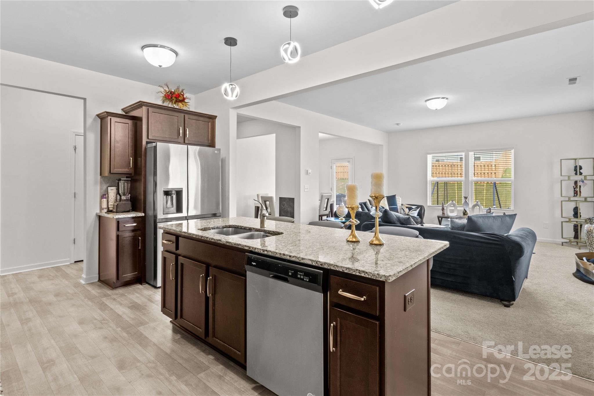 125 Mooring Drive Statesville, NC 28677 - Photo 6 of 32 a kitchen with stainless steel appliances granite countertop a sink a stove and refrigerator