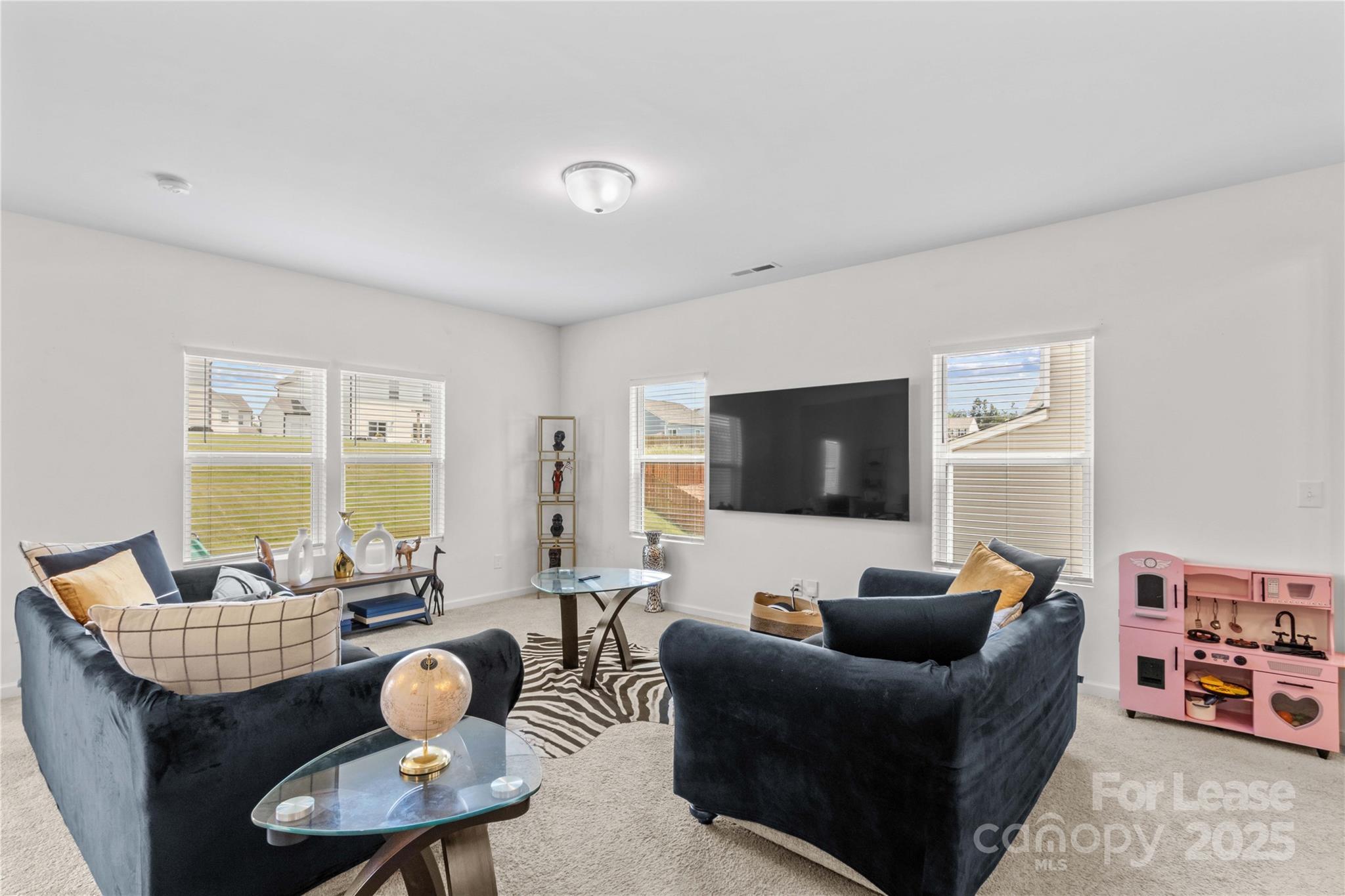 125 Mooring Drive Statesville, NC 28677 - Photo 8 of 32 a living room with furniture and a flat screen tv