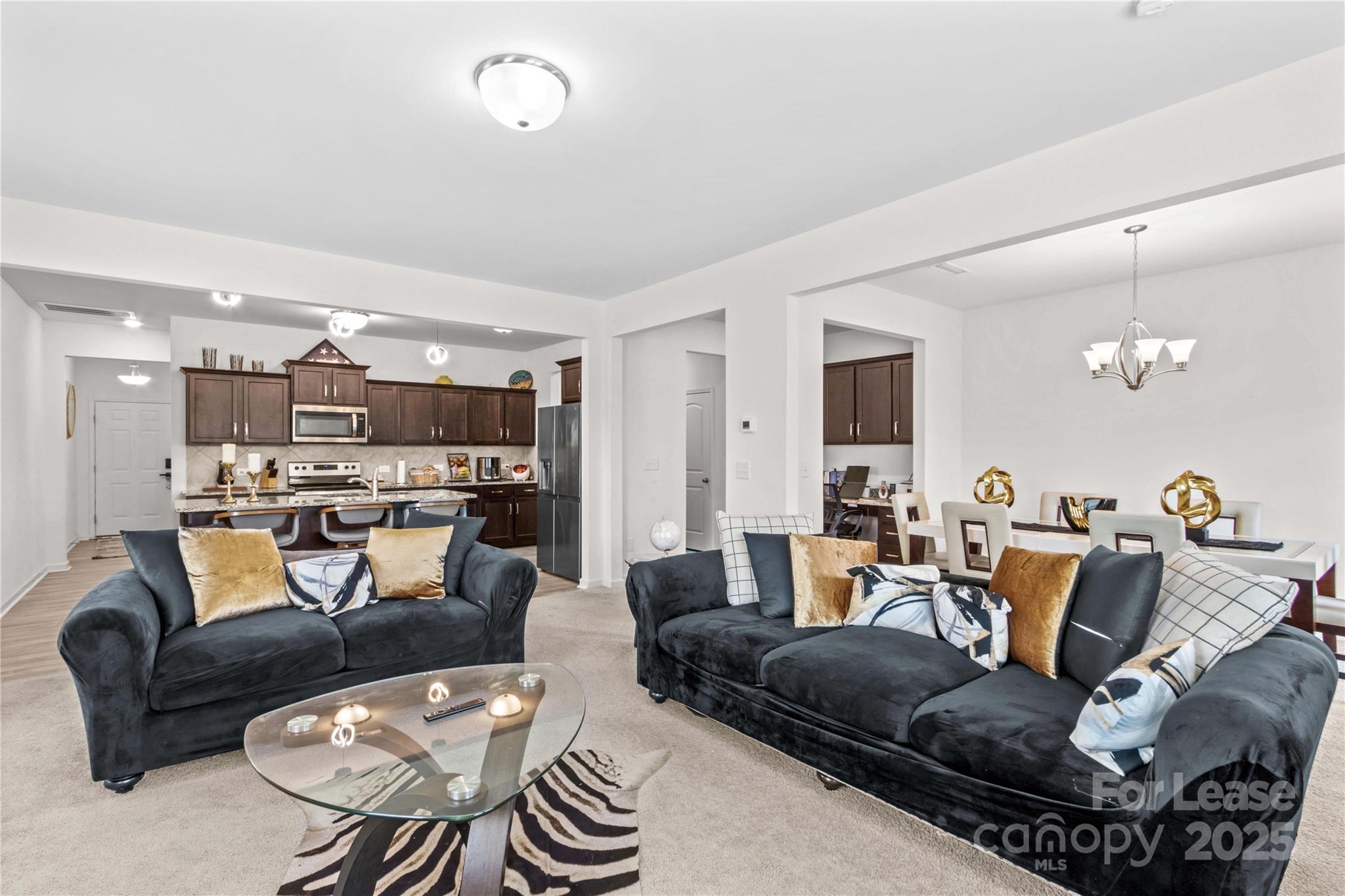 125 Mooring Drive Statesville, NC 28677 - Photo 10 of 32 a living room with furniture kitchen view and a wooden floor