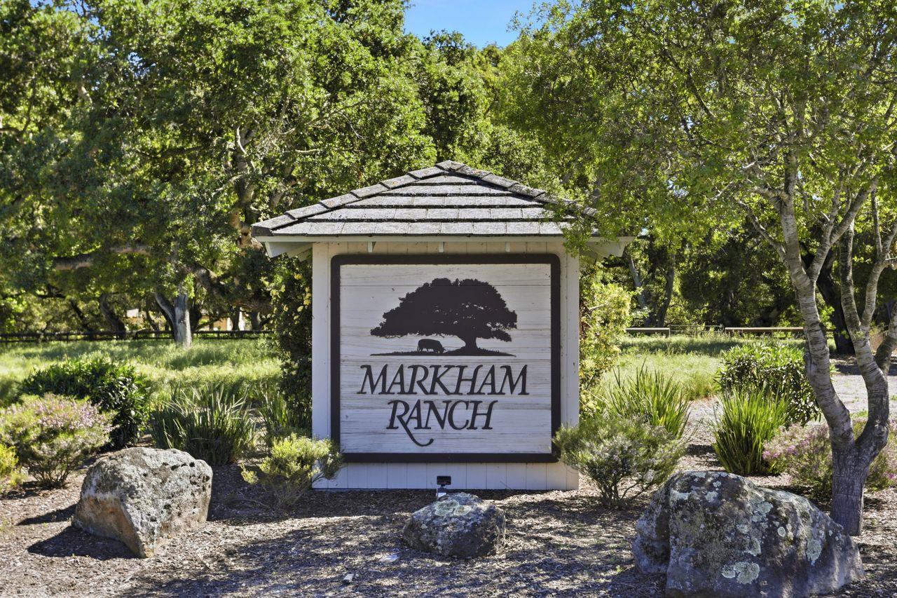 25381 Markham Lane Salinas, CA 93908 - Photo 1 of 47 a sign that is sitting in front of a big yard with potted plants