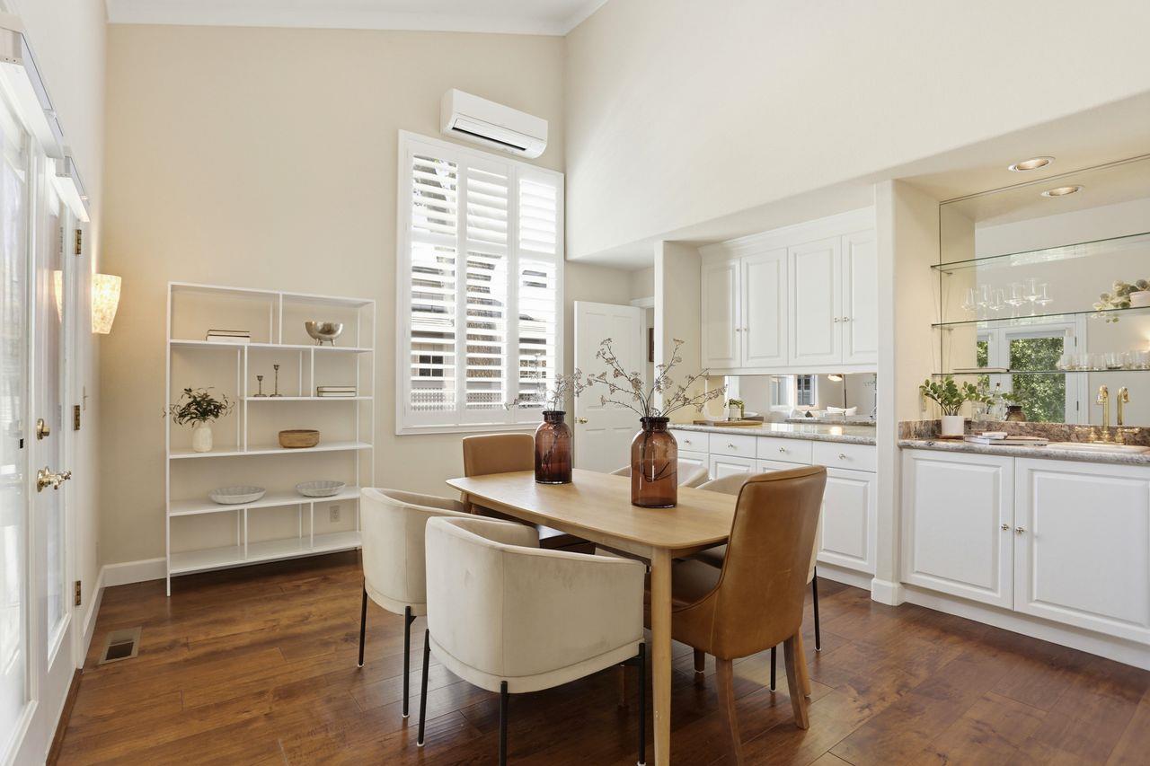 25381 Markham Lane Salinas, CA 93908 - Photo 12 of 47 a kitchen with a dining table chairs and white cabinets
