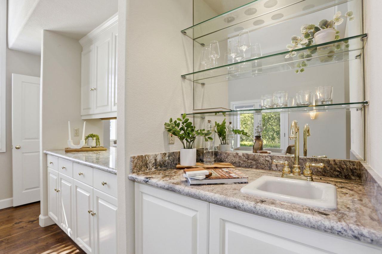25381 Markham Lane Salinas, CA 93908 - Photo 13 of 47 a bathroom with a granite countertop sink and a mirror