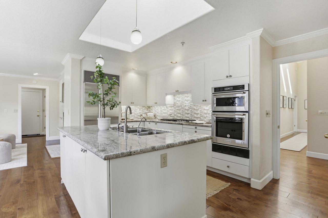 25381 Markham Lane Salinas, CA 93908 - Photo 15 of 47 a kitchen with stainless steel appliances granite countertop a sink and a refrigerator